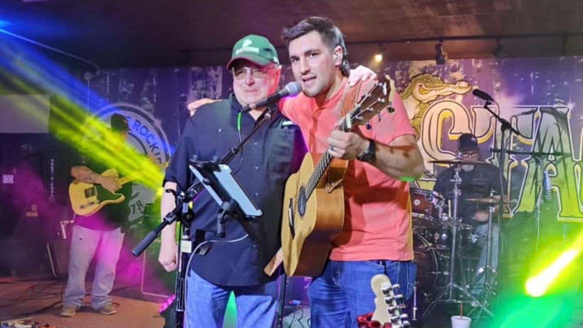 Mark Chesnutt and his son Casey in a concert.