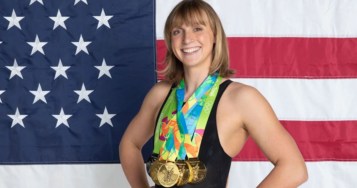 Katie Ledecky smiling with her gold medals