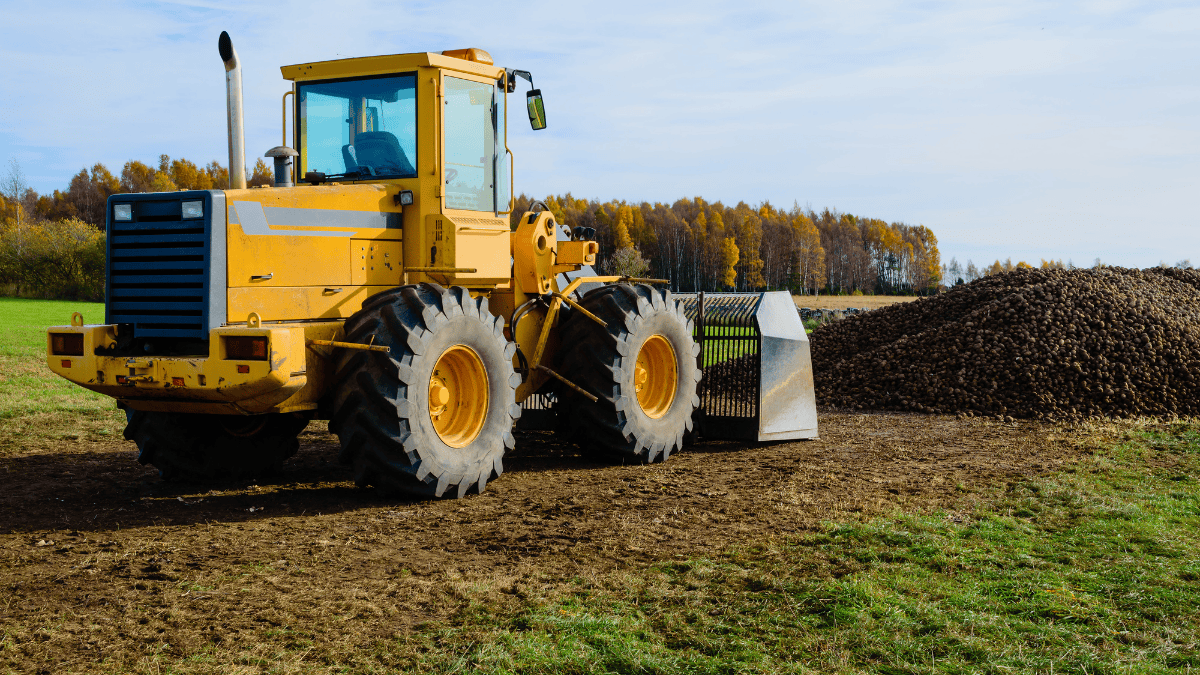 an image of front loader farming