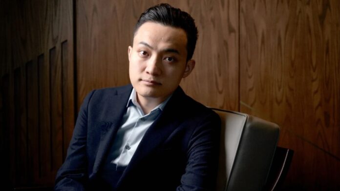 Justin Sun wearing a black suit