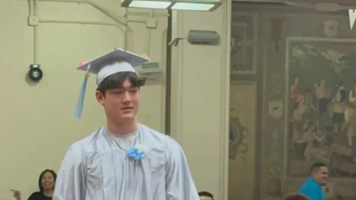 Kephas Pope wearing a graduation cap